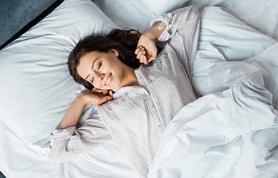 Woman waking up after a restful sleep